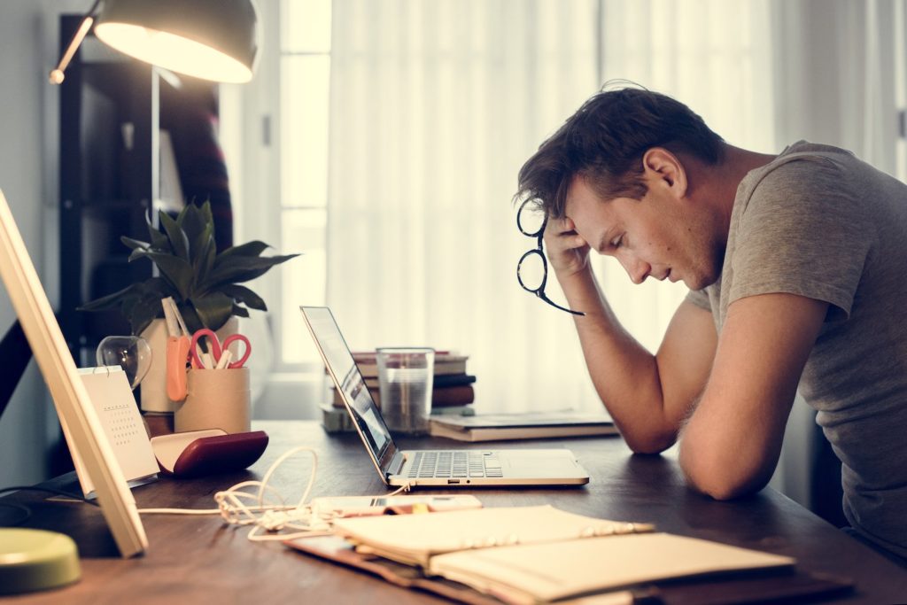 man-stressed-while-working-on-laptop-PVWFBU8 man-stressed-while-working-on-laptop-PVWFBU8