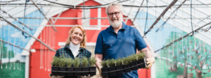 Employee engagement through sustainable initiatives. Pictured is a couple gardening.